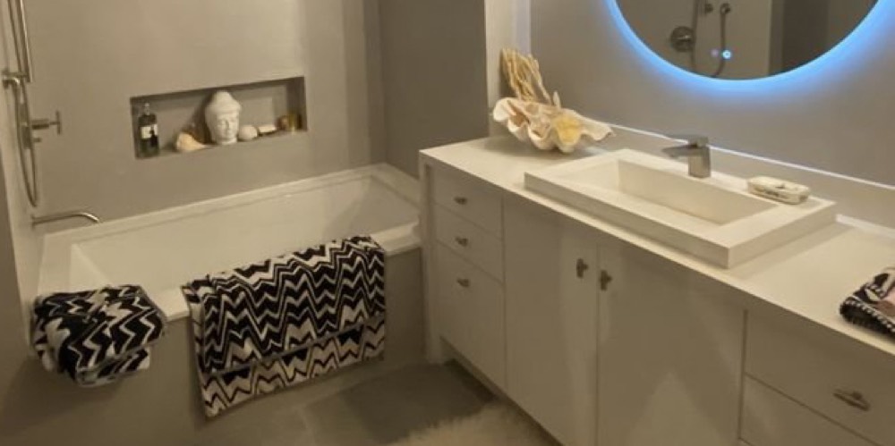 Bathroom with cultured marble tub and surround